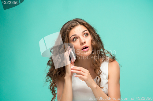 Image of The portrait of disgusted woman with mobile phone