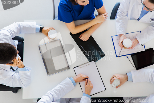 Image of group of doctors having coffee break at hospital