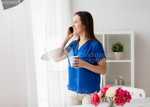 Image of woman calling on smartphone at office or home