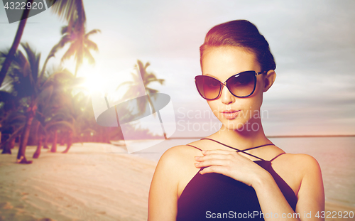 Image of beautiful young woman in elegant black sunglasses