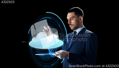 Image of businessman with tablet pc and cloud projection