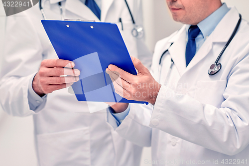 Image of close up of doctors with clipboard at hospital