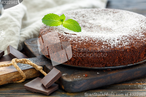 Image of Chocolate cake dusted with powdered sugar.