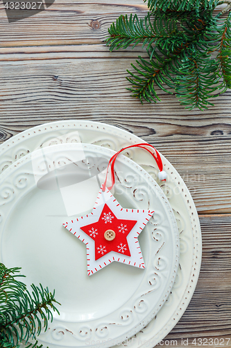 Image of Porcelain plates with Christmas decor.