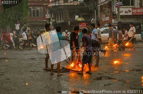 Image of Boys around fireplace in Nepal