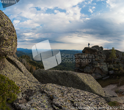 Image of Man on the peak in mountains