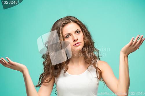 Image of Portrait of young woman with shocked facial expression