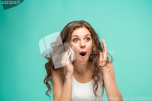Image of The portrait of disgusted woman with mobile phone