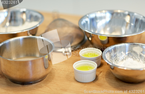 Image of bowls with flour and egg whites at bakery kitchen