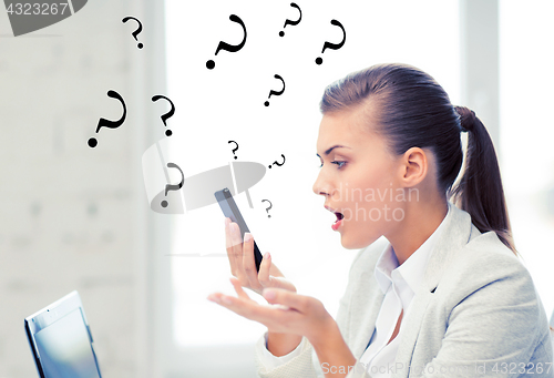 Image of woman shouting into smartphone