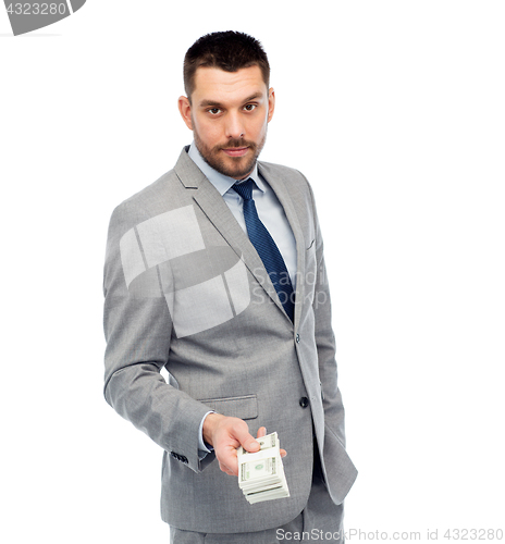 Image of businessman with american dollar money