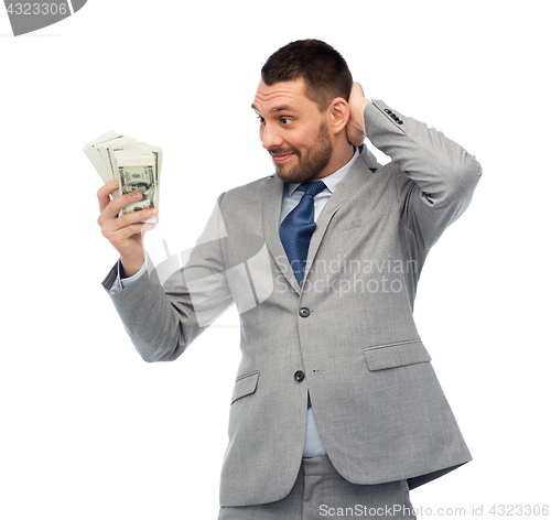 Image of smiling businessman with american dollar money