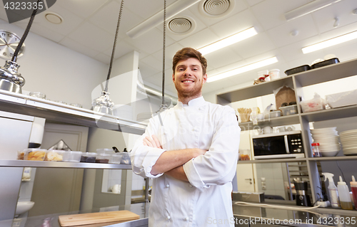 Image of happy male chef cook at restaurant kitchen