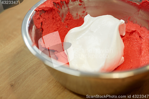 Image of macaron batter with whipped egg whites in bowl