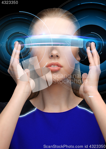 Image of woman in virtual reality 3d glasses with hologram