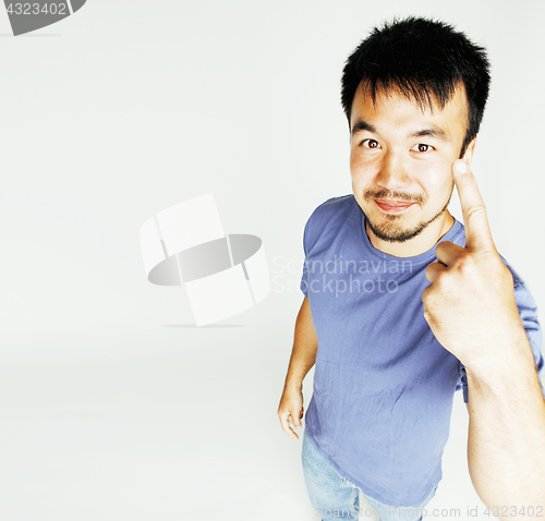 Image of young cute asian man on white background gesturing emotional, po