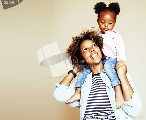 Image of adorable sweet young afro-american mother with cute little daugh