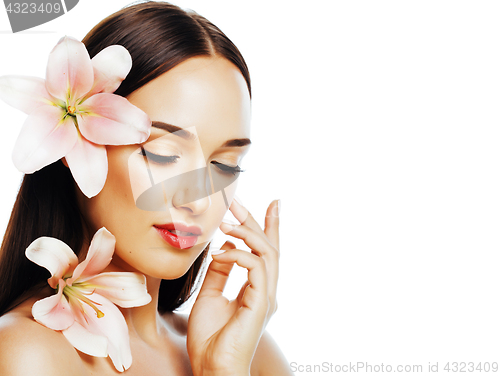 Image of young attractive lady close up with hands on face isolated flowe