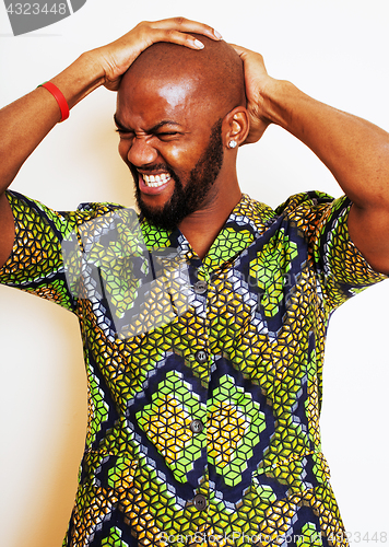 Image of portrait of young handsome african man wearing bright green nati