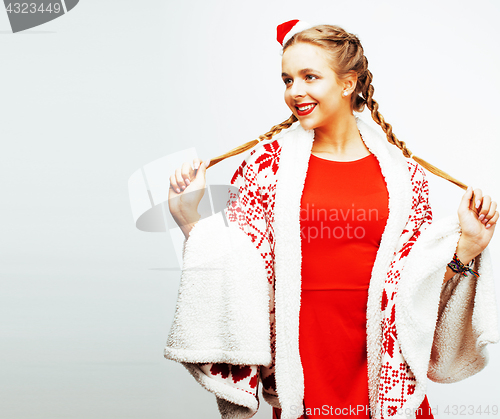 Image of young pretty happy smiling blond woman on christmas in santas re