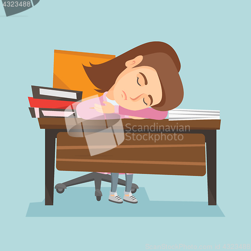 Image of Caucasian student sleeping on the desk with books.