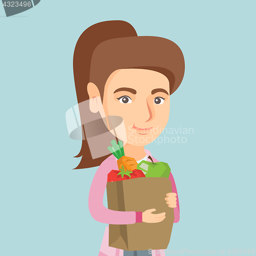 Image of Woman holding shopping bag with healthy food.