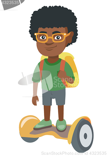 Image of African schoolboy riding on gyroboard to school.