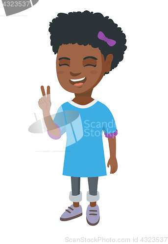 Image of African little girl showing victory gesture.