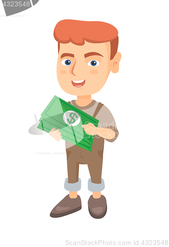 Image of Caucasian boy holding money in hands.