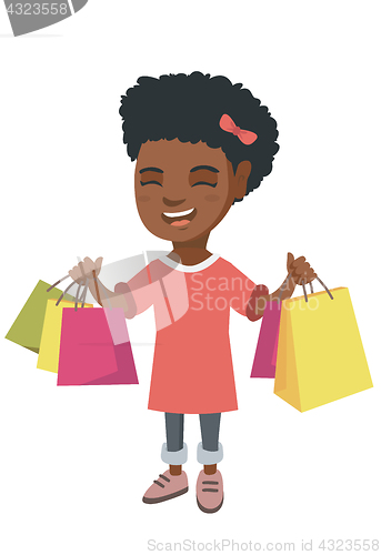 Image of Happy african-american girl holding shopping bags.