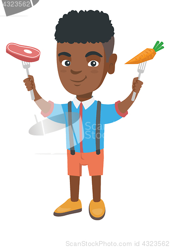 Image of Little african boy holding fresh carrot and steak.