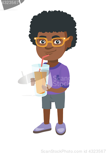 Image of Boy drinking orange juice through a straw.