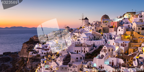 Image of Oia village at sunset, Santorini island, Greece.