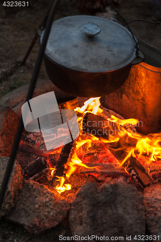 Image of Preparing food on campfire