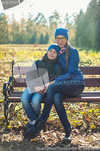 Image of Mother and son at autumn park