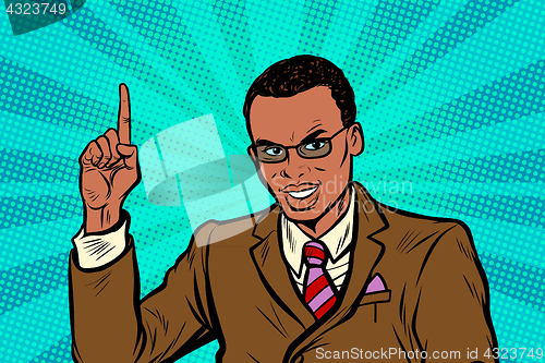 Image of African businessman pointing finger up