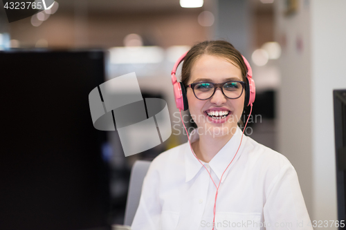 Image of businesswoman using a laptop in startup office