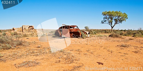 Image of old car and ruins