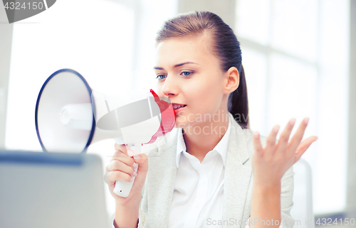 Image of strict businesswoman shouting in megaphone