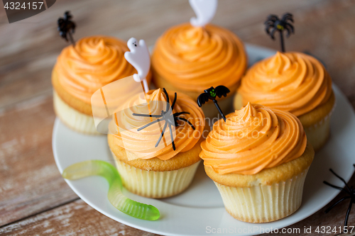 Image of halloween party decorated cupcakes on plate