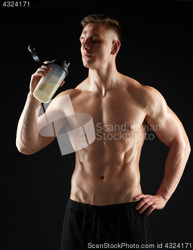 Image of young man or bodybuilder with protein shake bottle