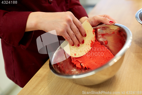 Image of chef making macaron batter at confectionery