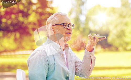 Image of old man using voice command recorder on smartphone