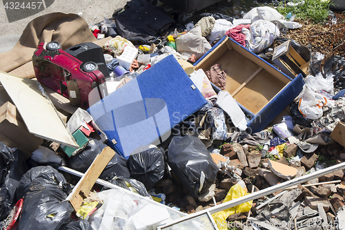 Image of Various household waste and garbage thrown away on the street