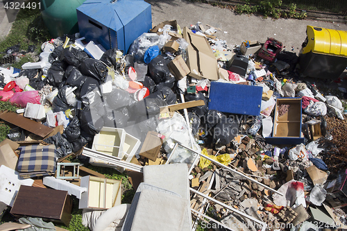 Image of Various household waste and garbage thrown away on the street