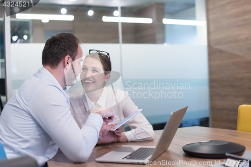 Image of Business People Working With Tablet in startup office