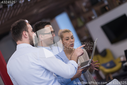 Image of Business team Working With laptop in creative office