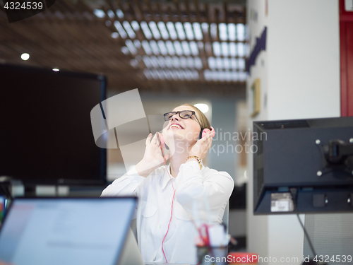 Image of businesswoman using a laptop in startup office