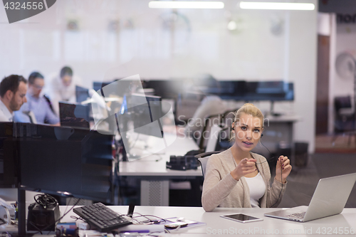 Image of businesswoman using a laptop in startup office