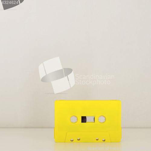 Image of Yellow retro audio cassette